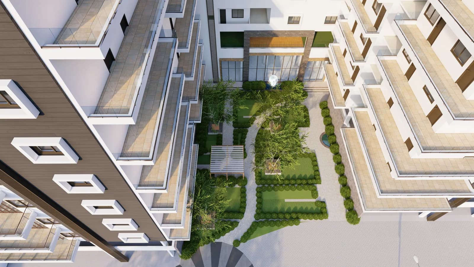 A landscaped court of paths and lawn between two wings, seen from above