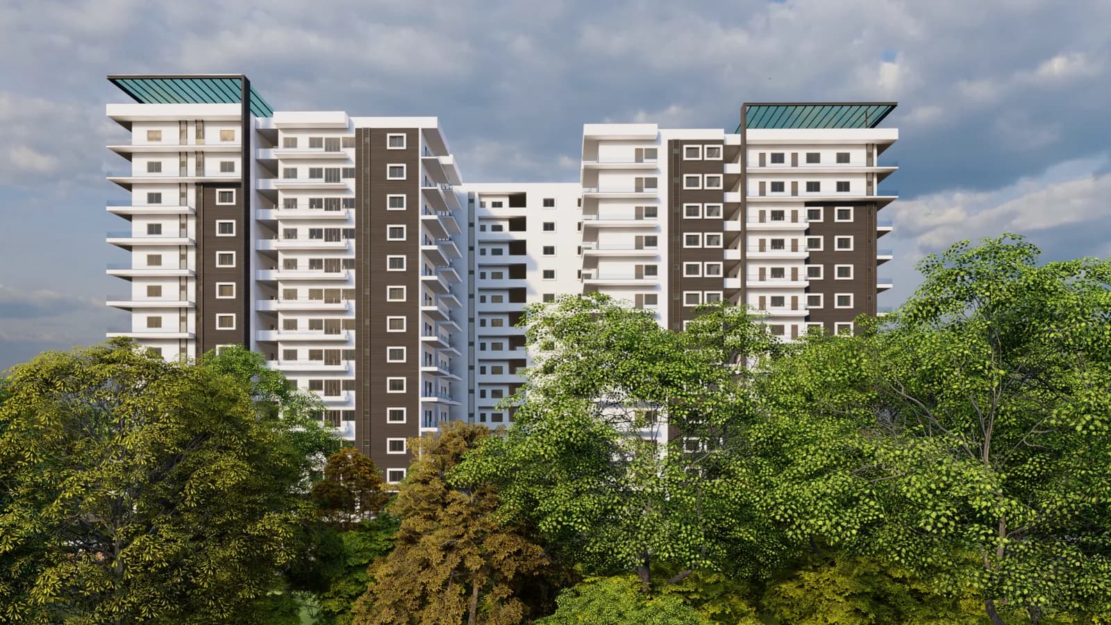 Residential towers rising behind a stand of mature trees