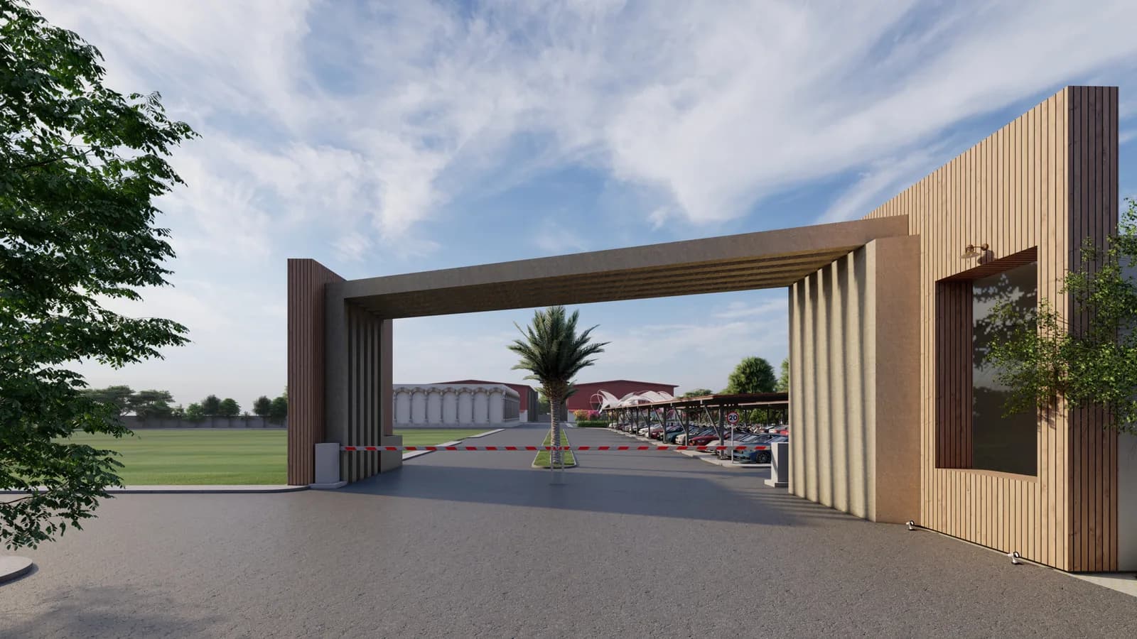 An entrance gate of tall timber fins framing the road into the studio campus