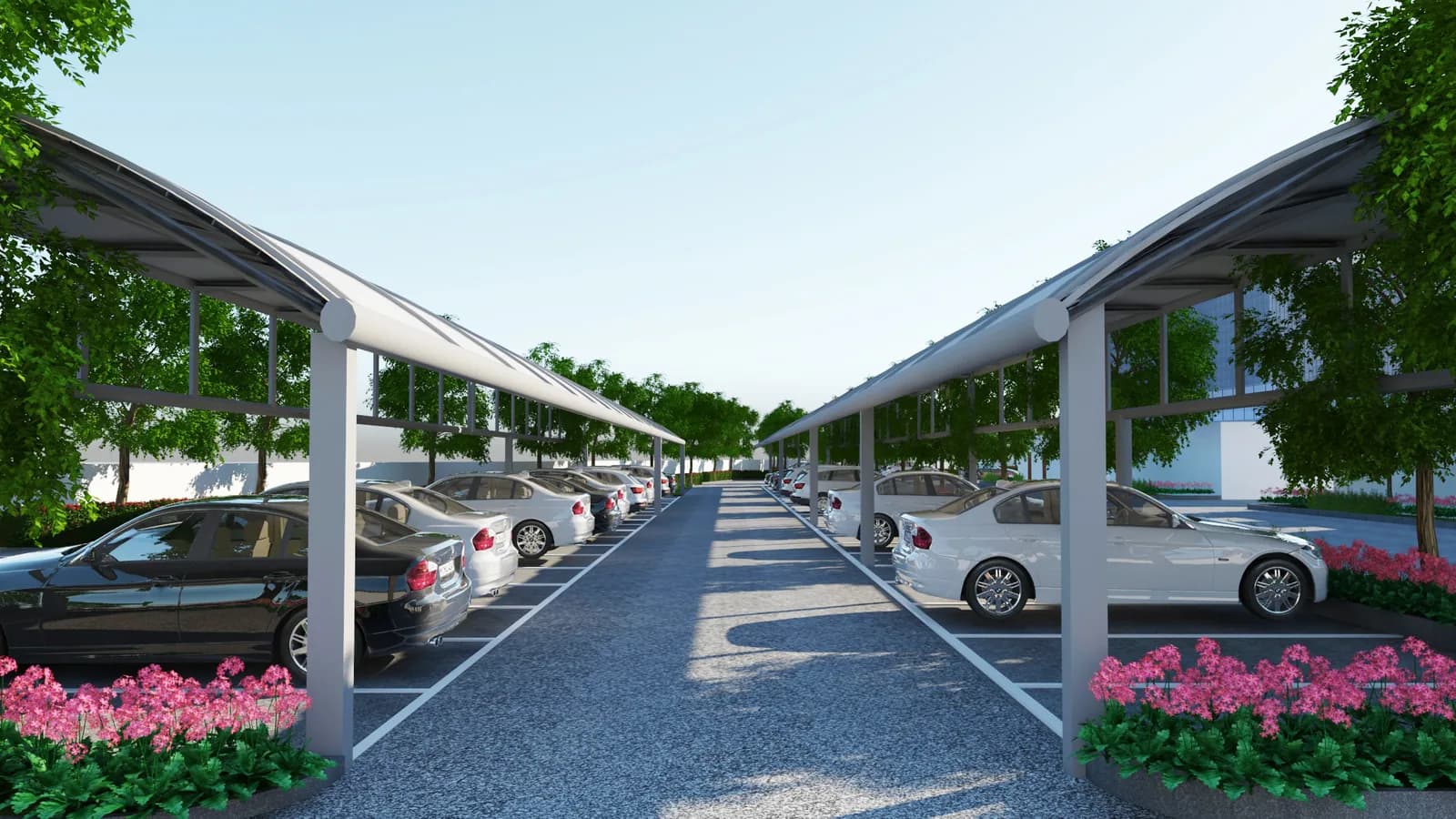 An avenue of parked cars under white tensile canopies, trees along both sides