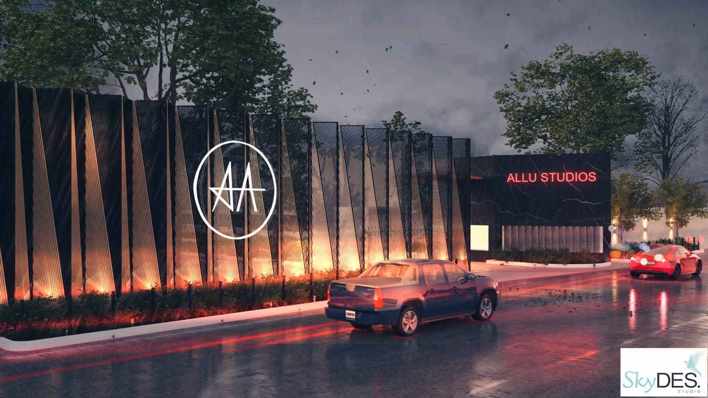 The studio frontage at night, a lit monogram above a wet forecourt and a parked car