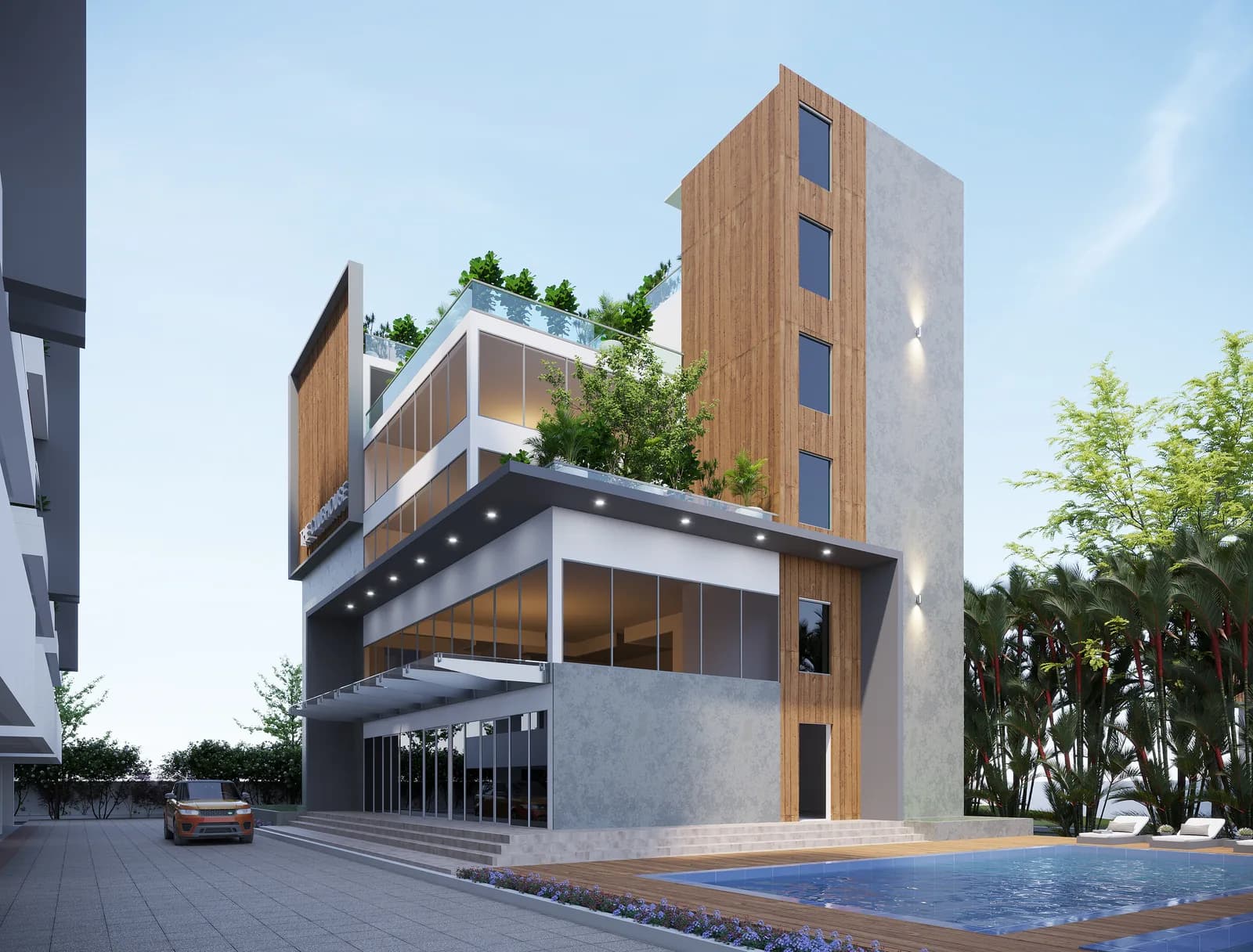 A clubhouse clad in timber and glass standing above a pool deck