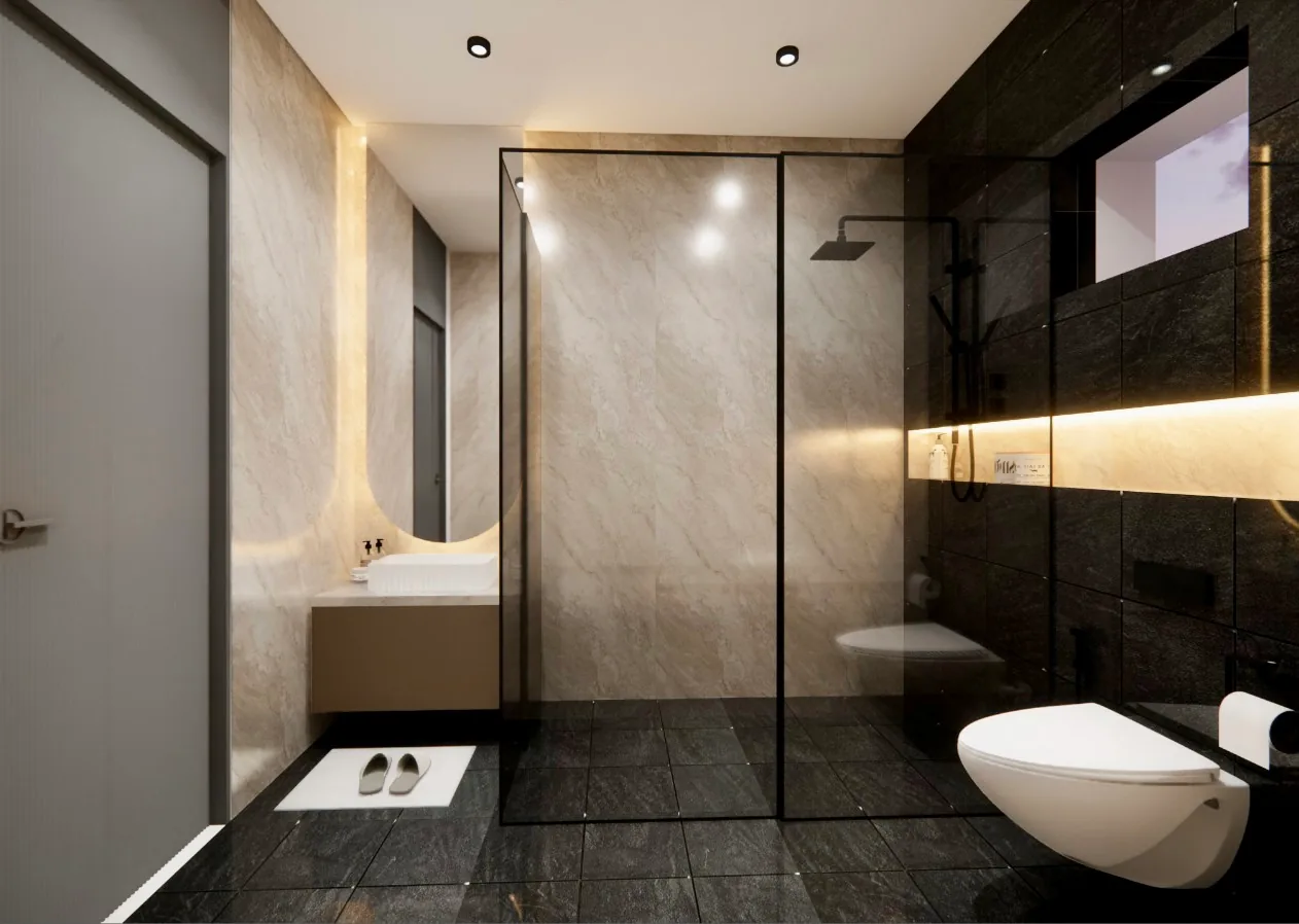 A bathroom lined in travertine and dark stone, with a backlit oval mirror