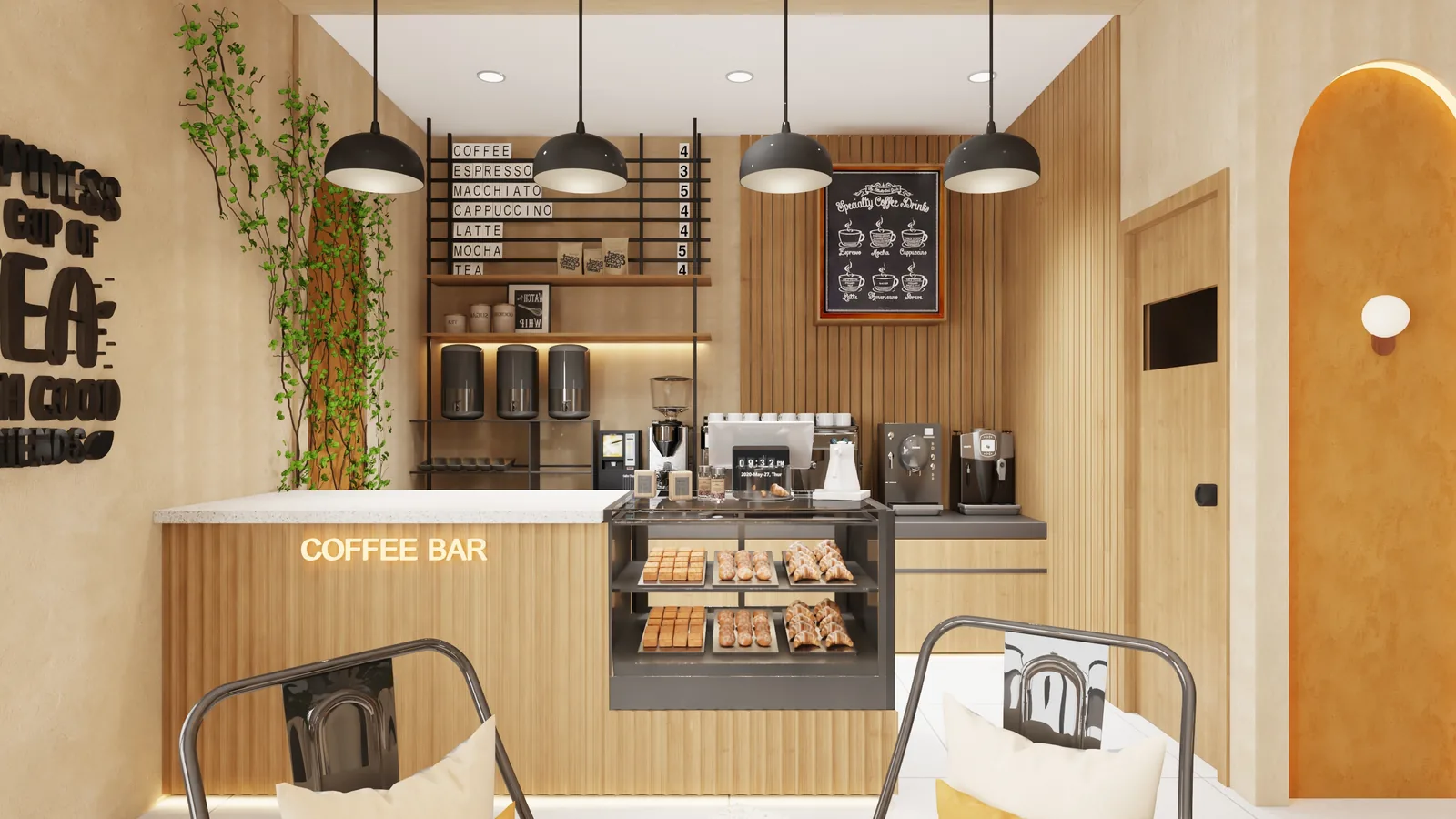 A coffee counter and glass pastry case in pale timber below dark dome pendants