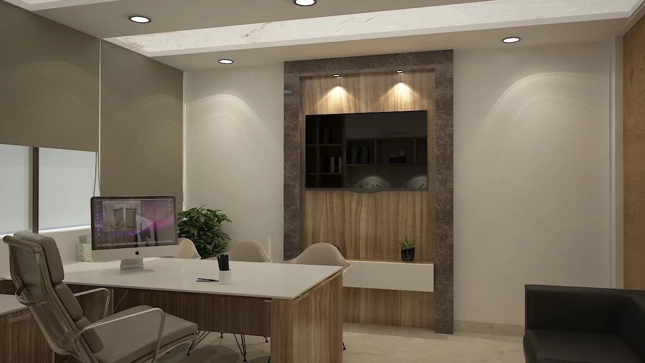 A director cabin with a stone-framed media wall behind a pale desk