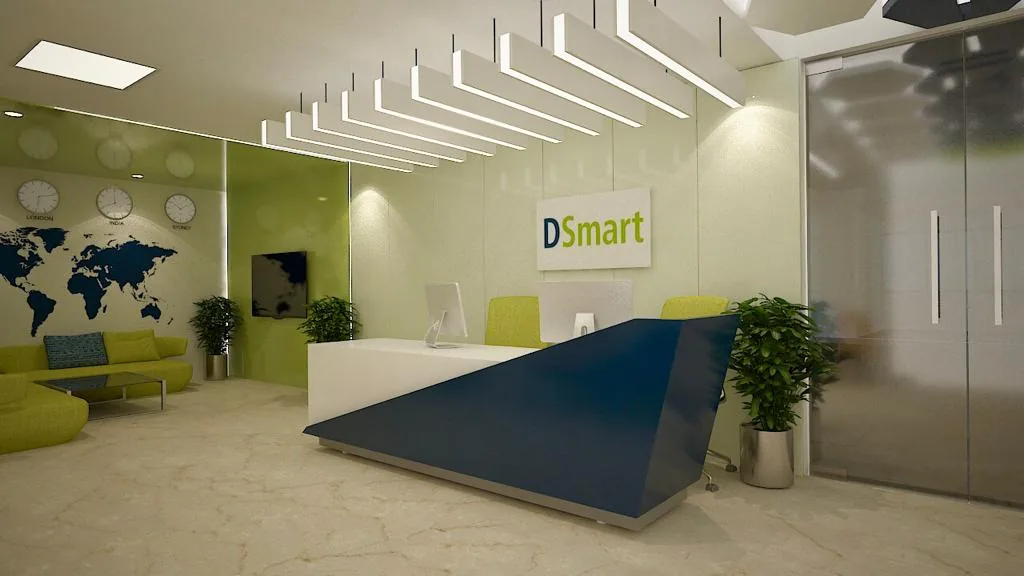 A reception desk below the company sign, with a world-map wall and green seating
