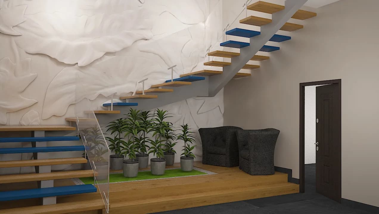 A stair hall with a floating timber stair against a sculpted relief wall