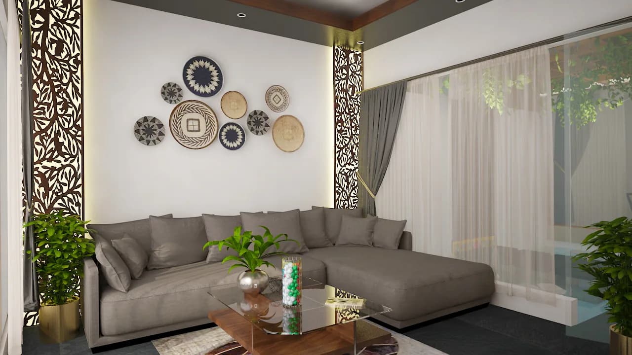 A low sectional sofa below a wall hung with decorative plates, beside a carved timber screen