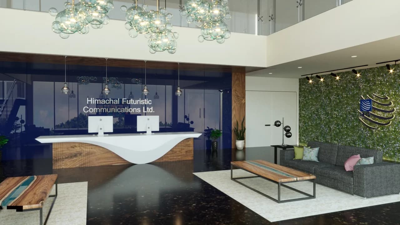 A double-height office reception, a sculpted white desk below a cluster of glass globe lights