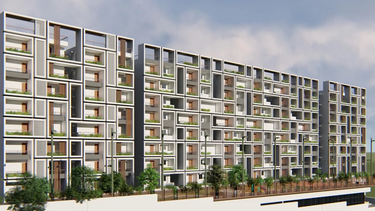 The deep white frame grid seen obliquely along the block, above a planted strip