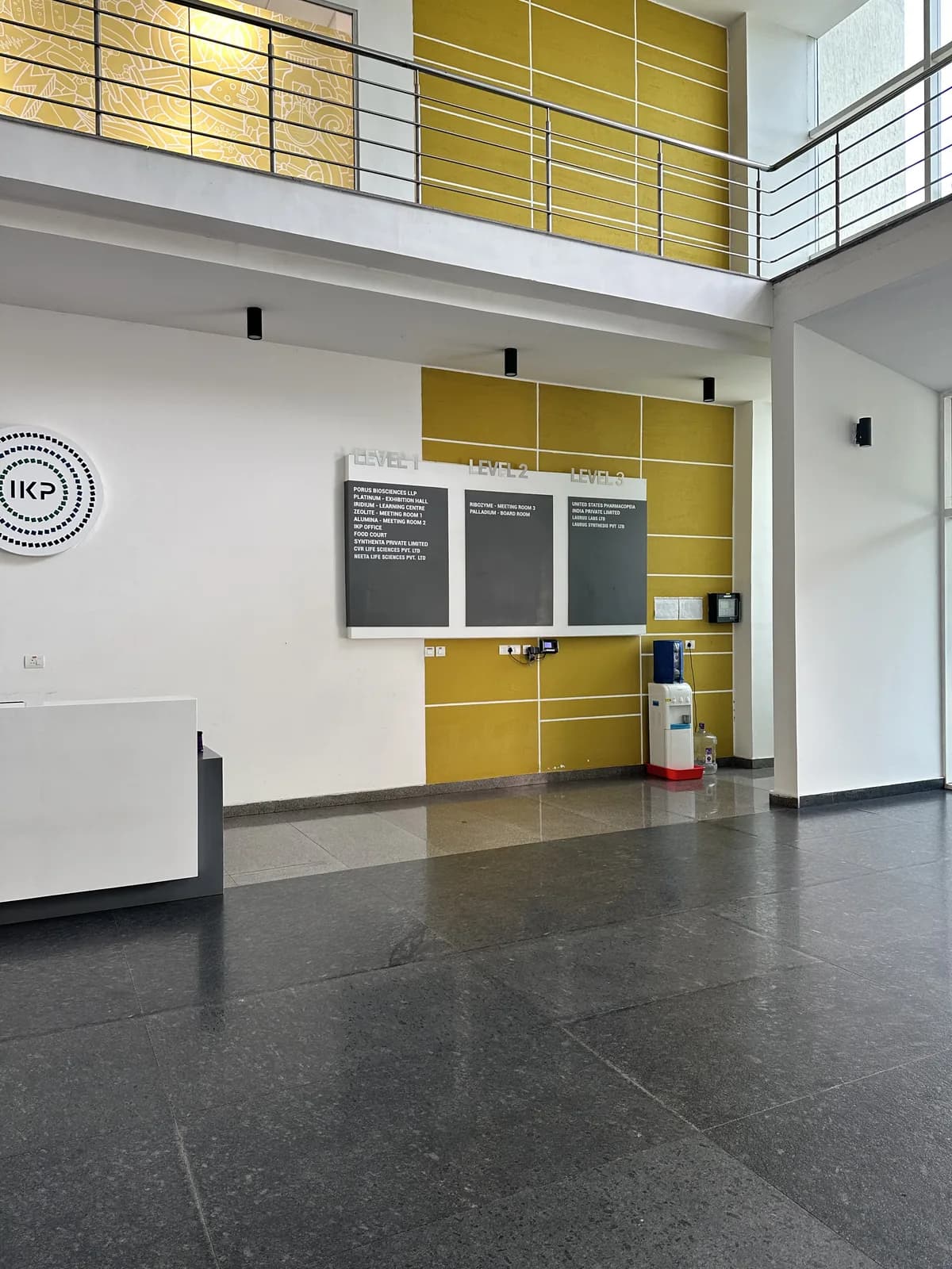 The reception hall seen beneath the mezzanine balustrade