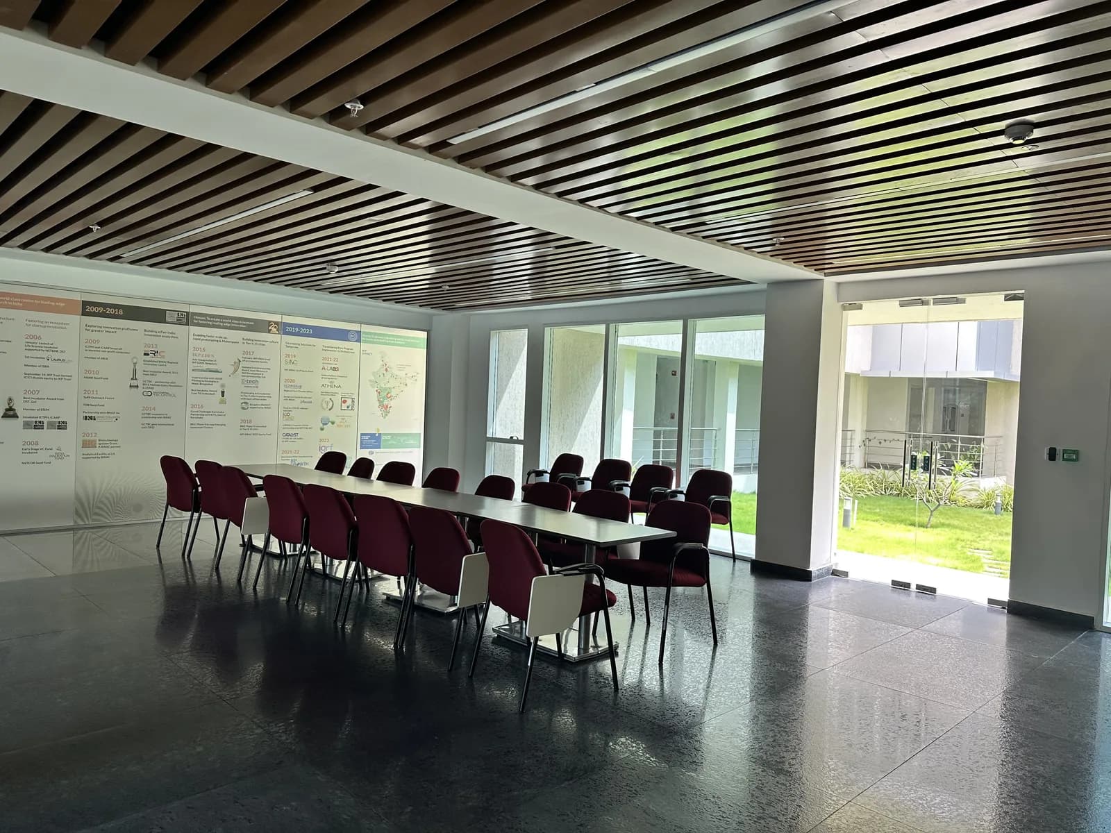 The learning hall from the rear, glazed along one side to the garden
