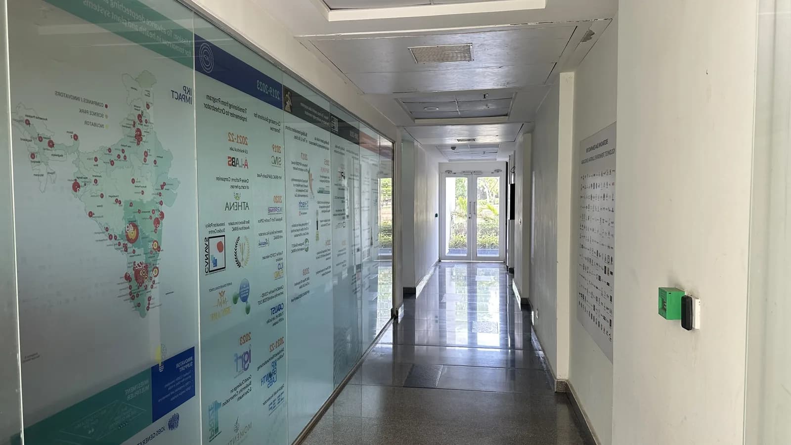 A corridor lined with printed information panels