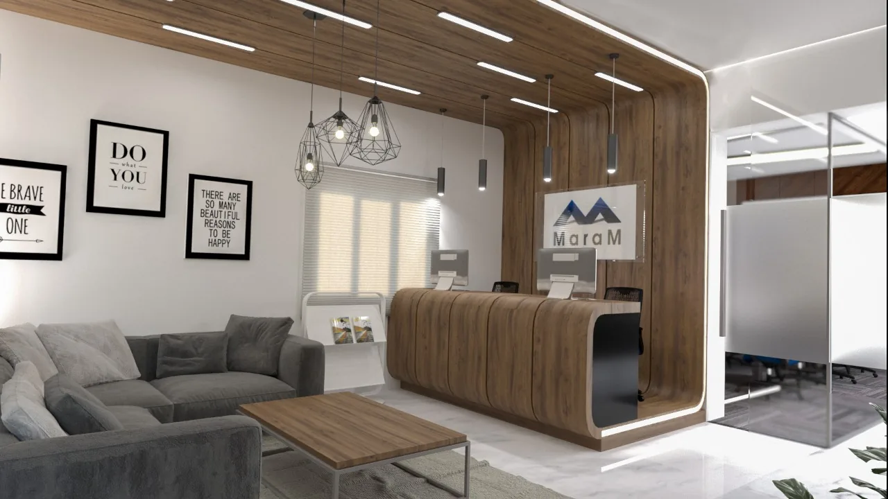 A curved walnut reception desk below the company sign, with a low sofa alongside