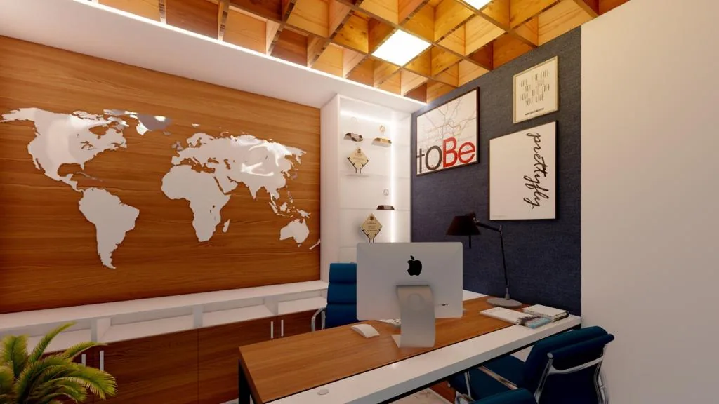 Workstations below a faceted timber ceiling, a carved world map on the wall