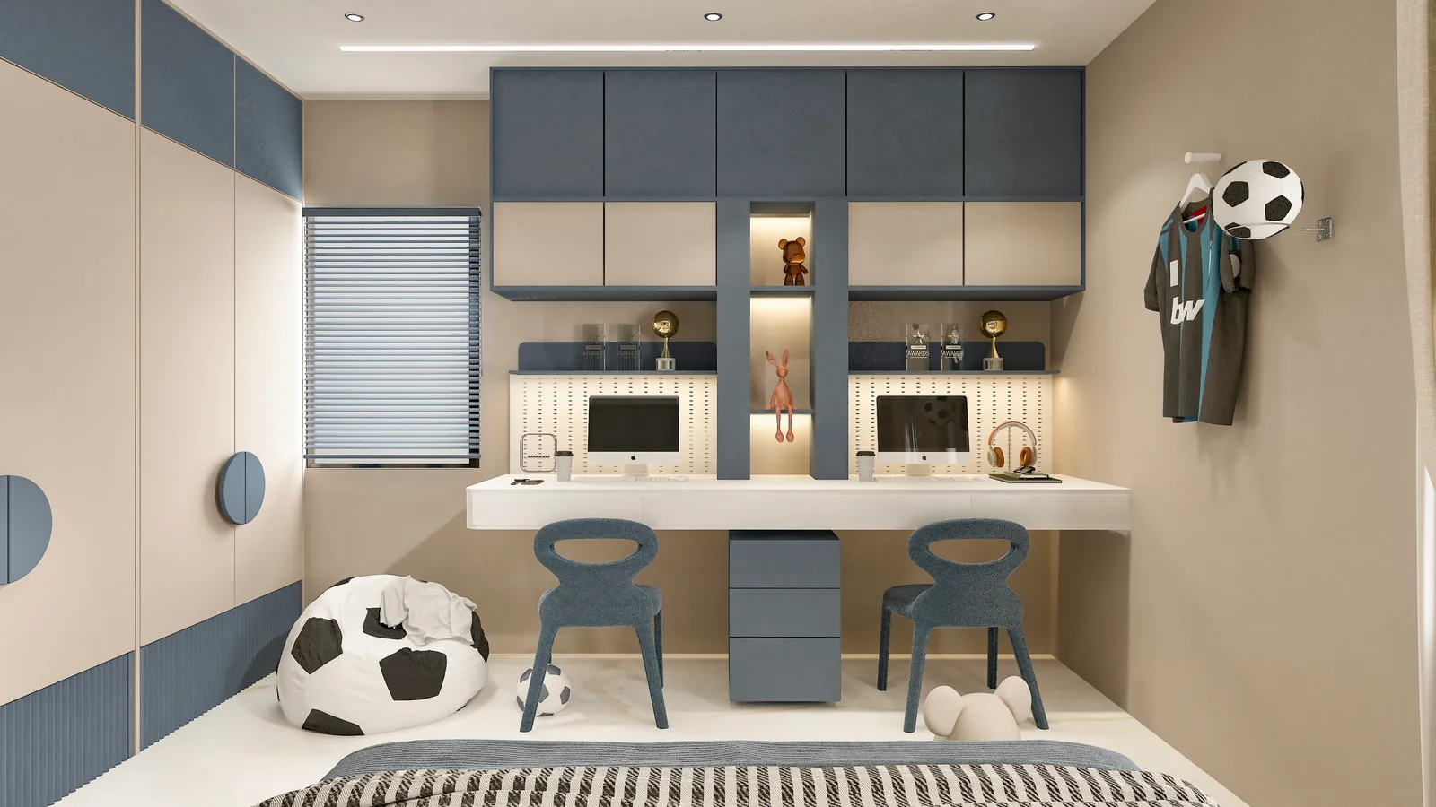 A child's study with blue cabinetry, twin desks and a football-patterned beanbag