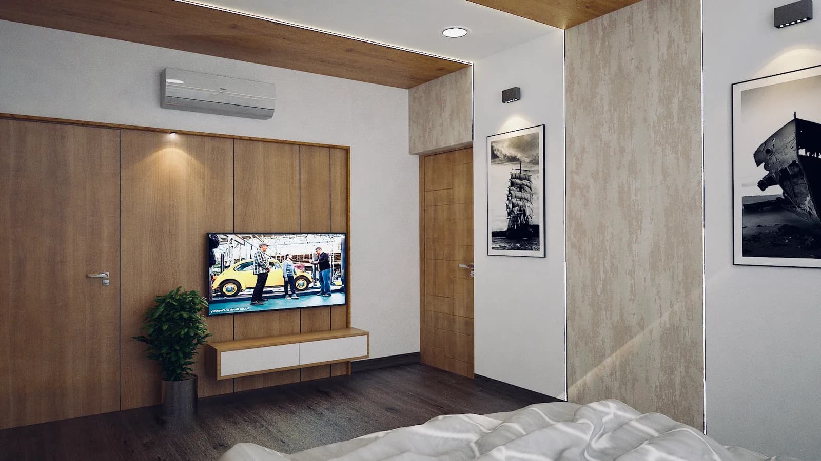 A bedroom with a screen set into a full-height timber wardrobe wall