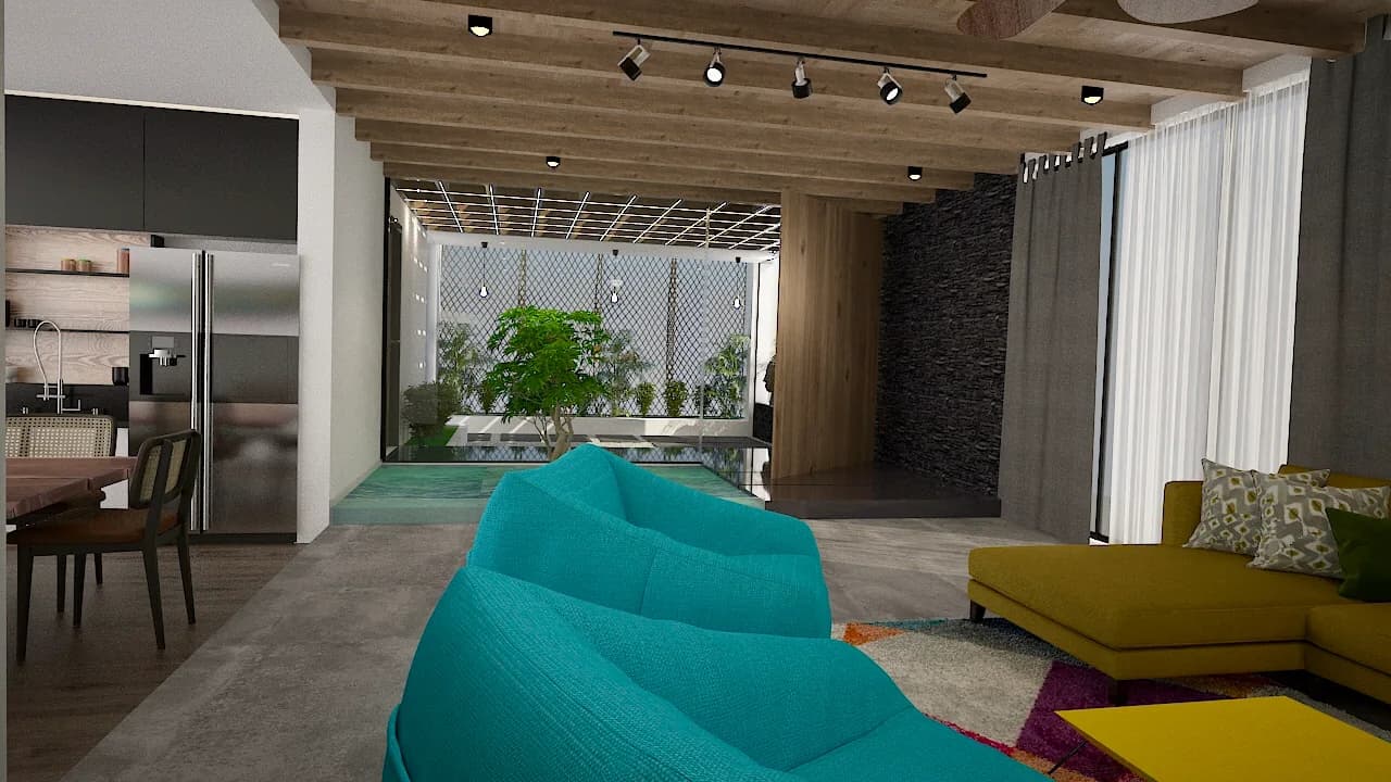 A living room with turquoise seating opening onto the planted water court