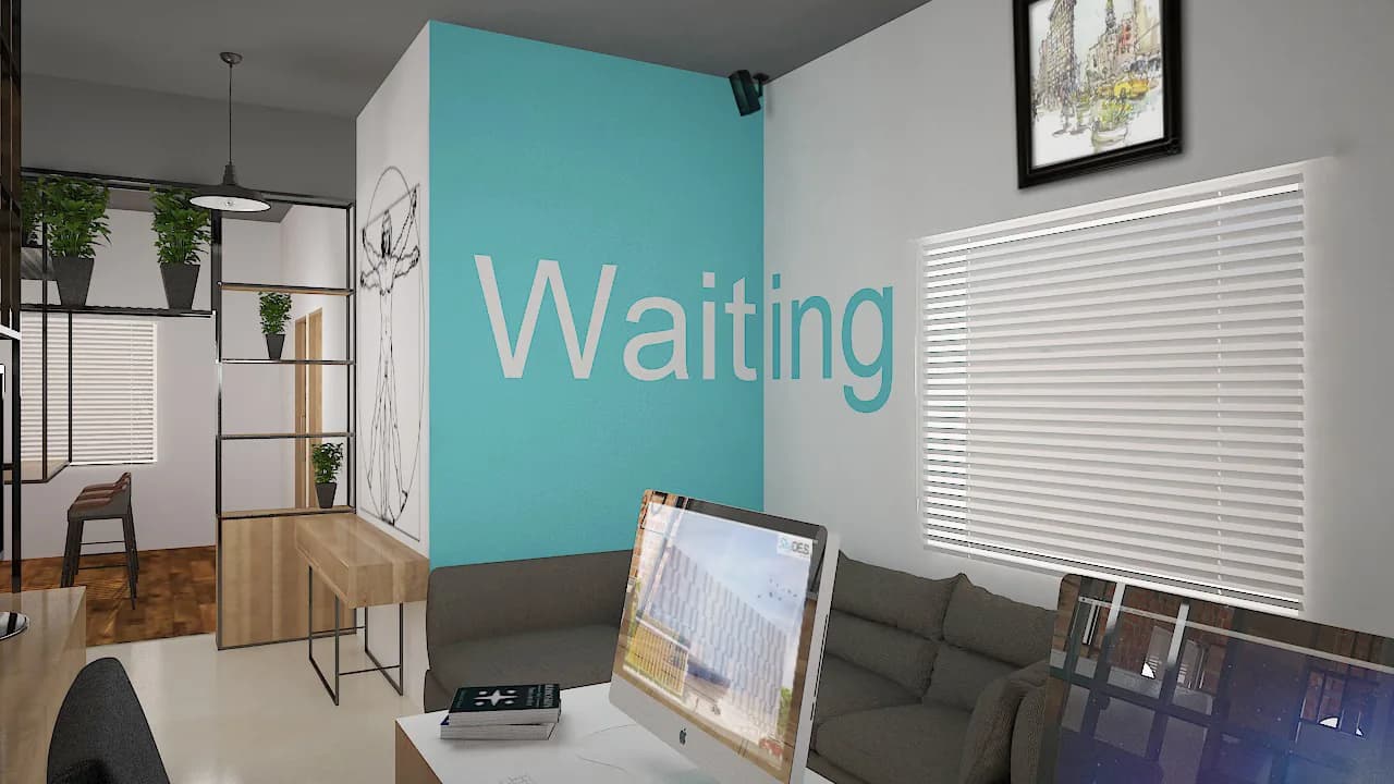 A waiting corner with low grey seating and a framed drawing against a painted wall