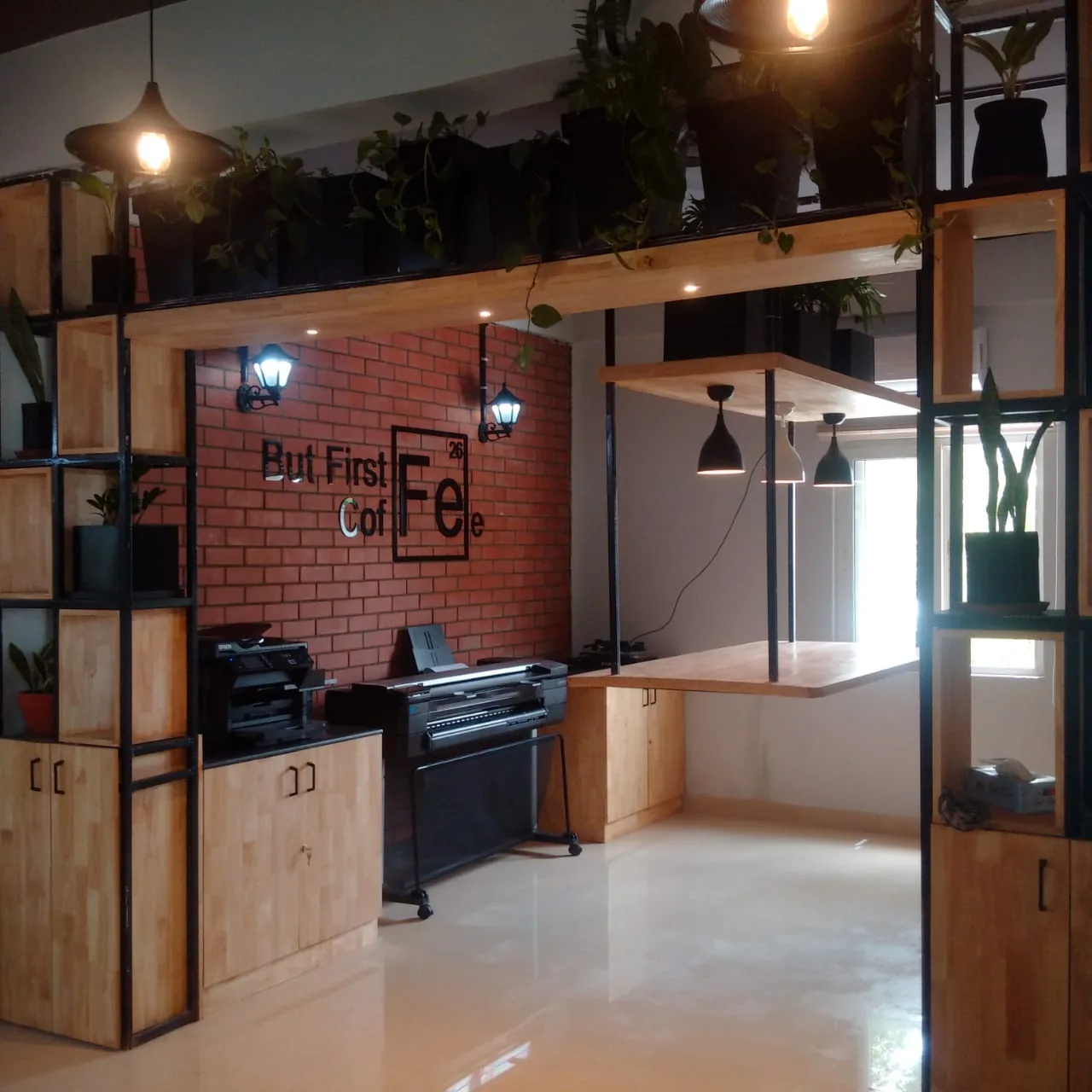 A coffee point in exposed brick beneath hanging planting